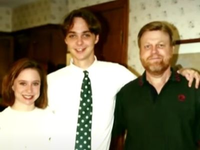Jim Parsons is standing in the middle of Milton Joseph Parsons, Jr. and Julie Ann Parsons.